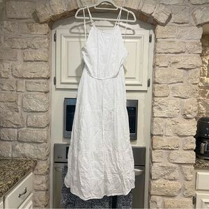 Flowy White Maxi Dress with Pockets, Adjustable Straps, and Cutout Detail